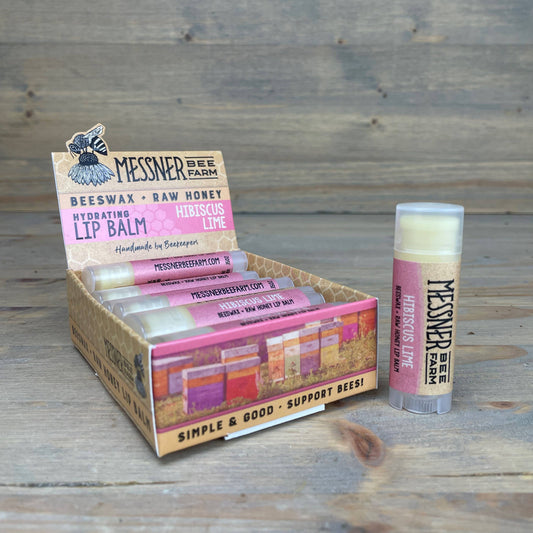 Messner Bee Farm lip balm packaging on a wooden surface