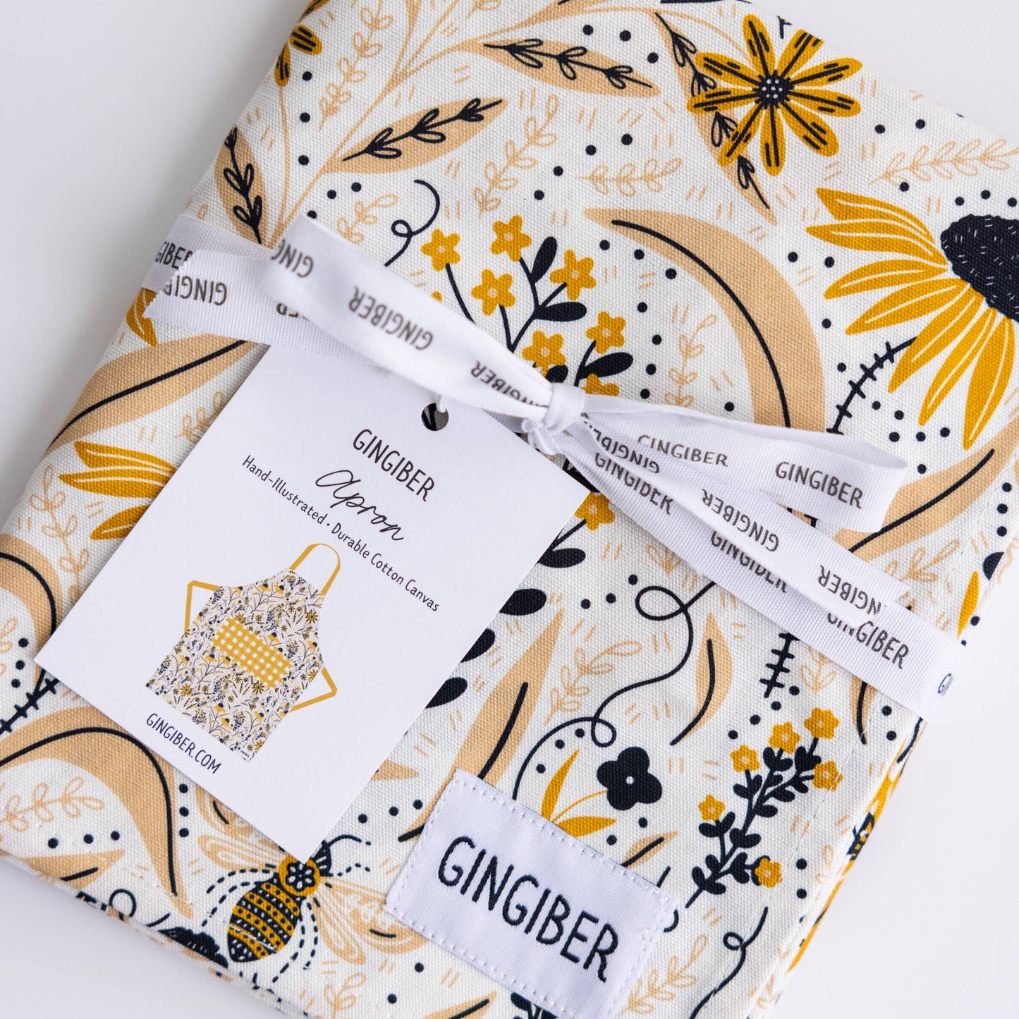 Packaging with floral design and 'GINGIBER' branding on a white background