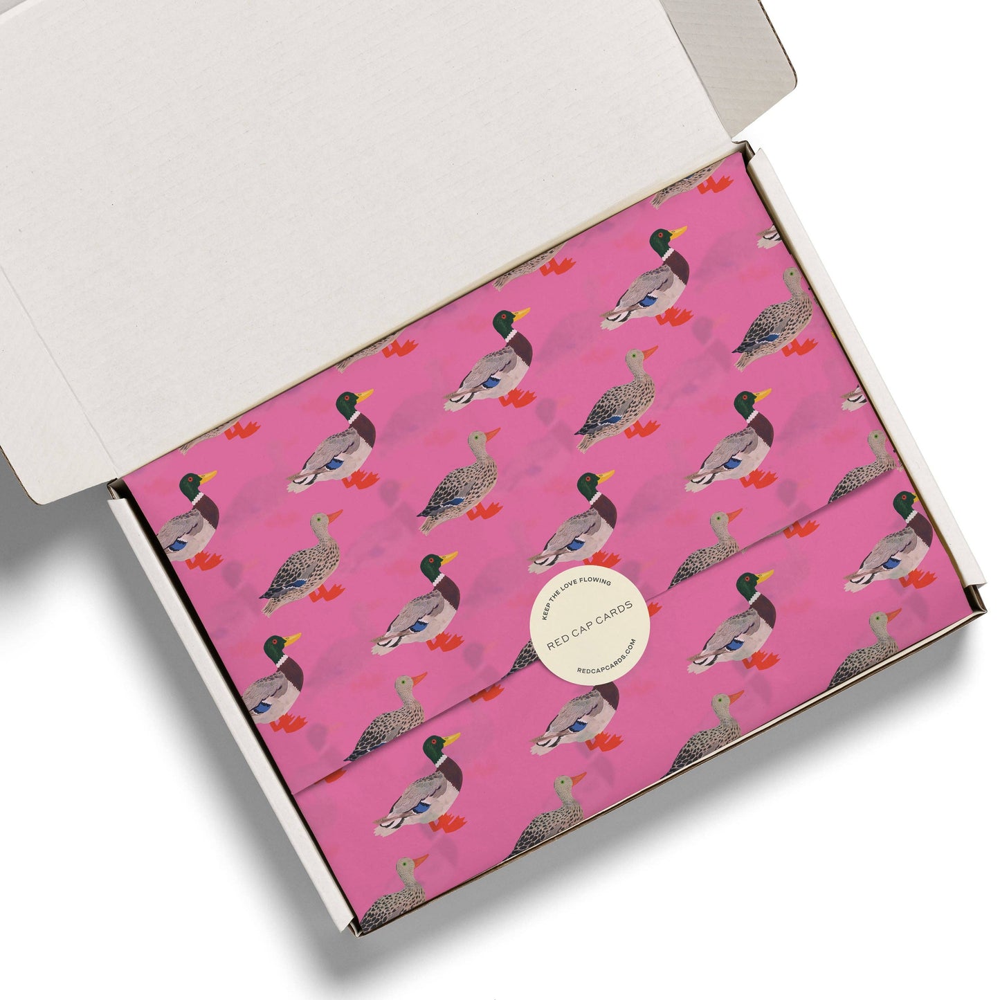 Pink box with duck pattern on a white background