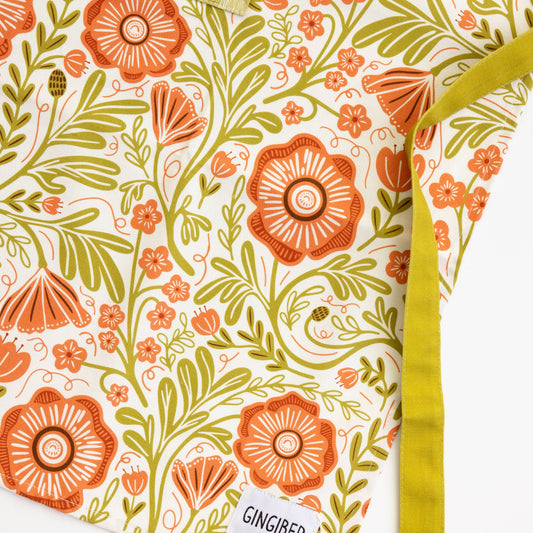 Floral patterned fabric with 'GINGER' label on a white background