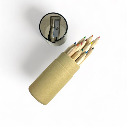 Pencil sharpener with a cylindrical container holding colored pencils on a white background