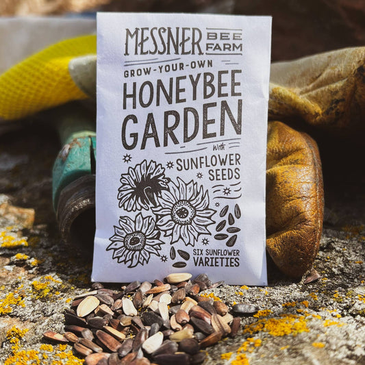 Messner Bee Farm honeybee garden seed packet on a natural background with seeds scattered around.
