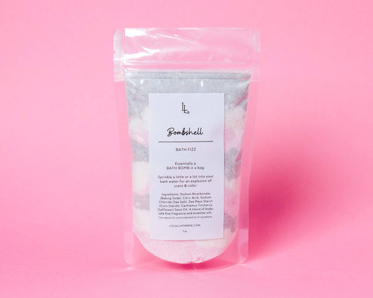 Packaged bath fizz on a pink background