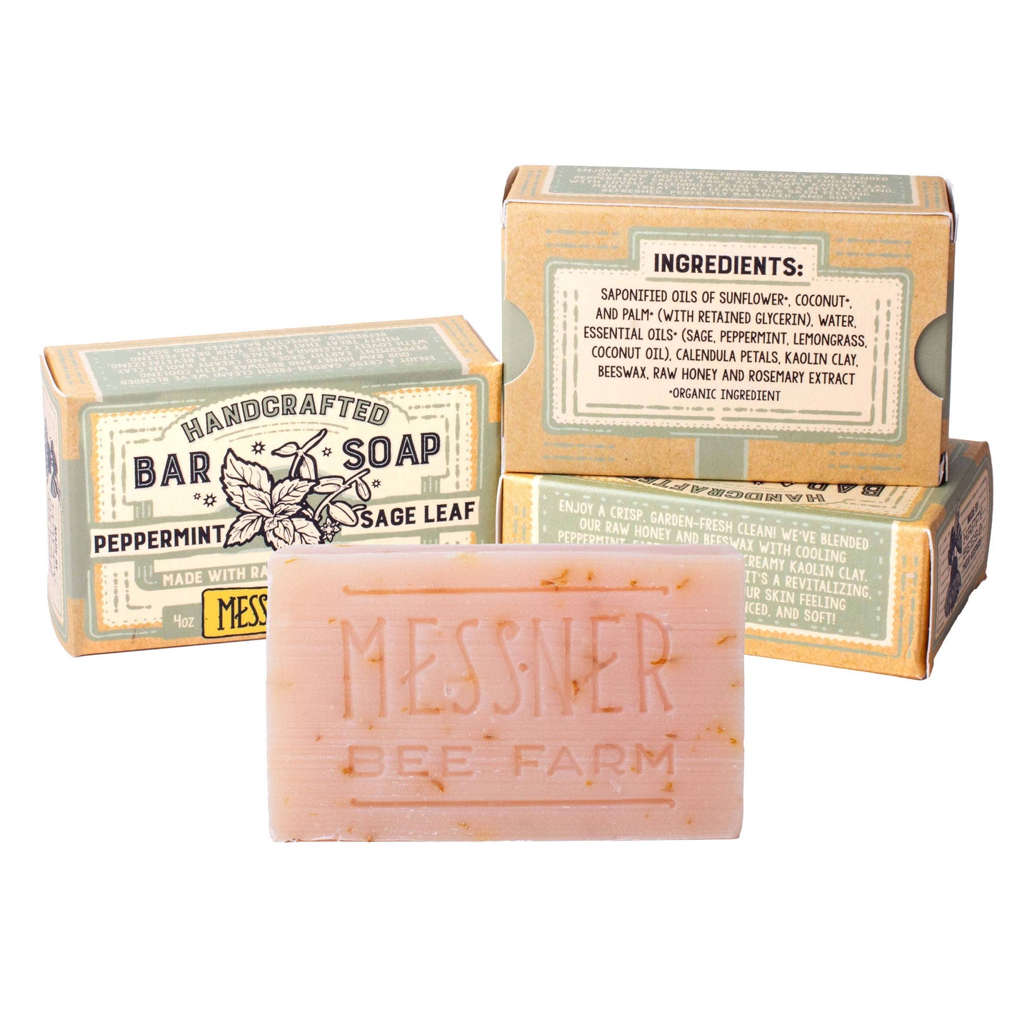 Messner Bee Farm handcrafted bar soap in Peppermint Sage Leaf scent, shown as a pink bar with speckles in front of its kraft paper packaging boxes on a white background.