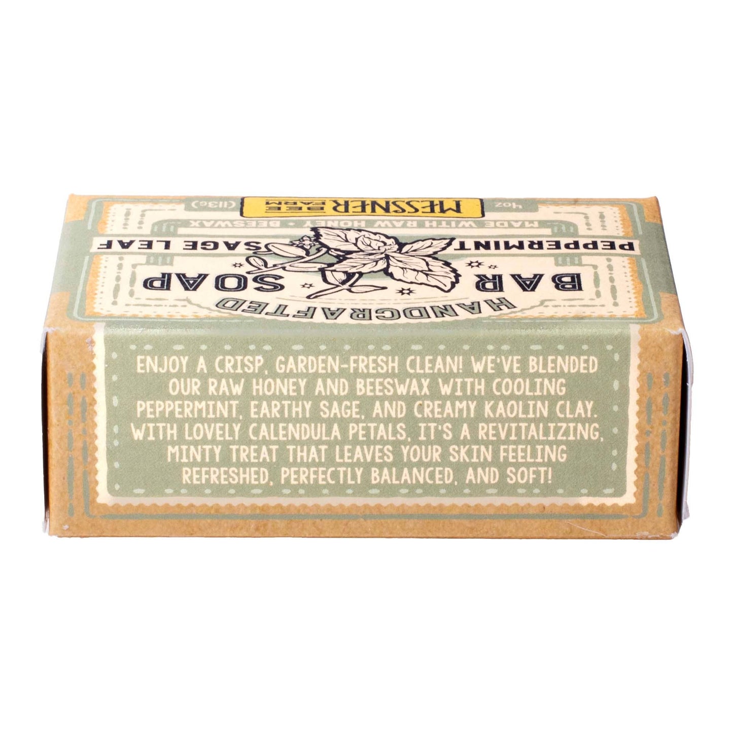 Handcrafted Bar Soap in a square kraft paper box with a vintage-style label. The label features a muted green top section and a tan/brown bottom section with cream-colored text describing the scent as a blend of peppermint, earthy sage, and creamy kaolin clay.