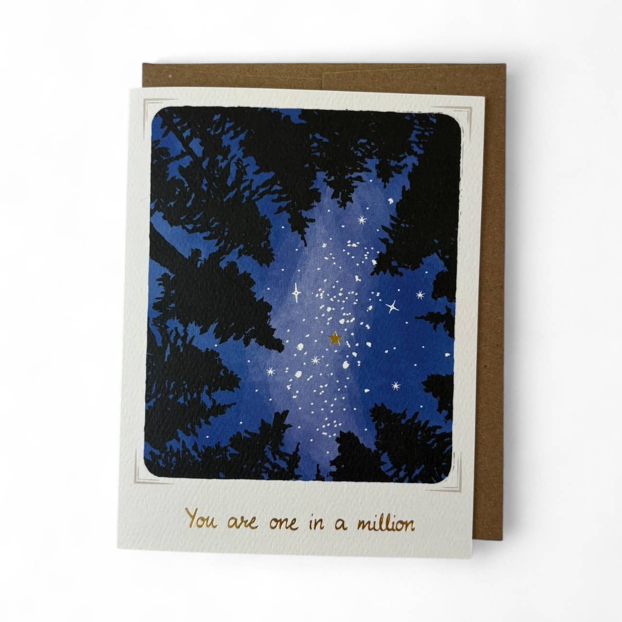 Greeting card with starry night sky and tree silhouettes, featuring the text 'You are one in a million'.
