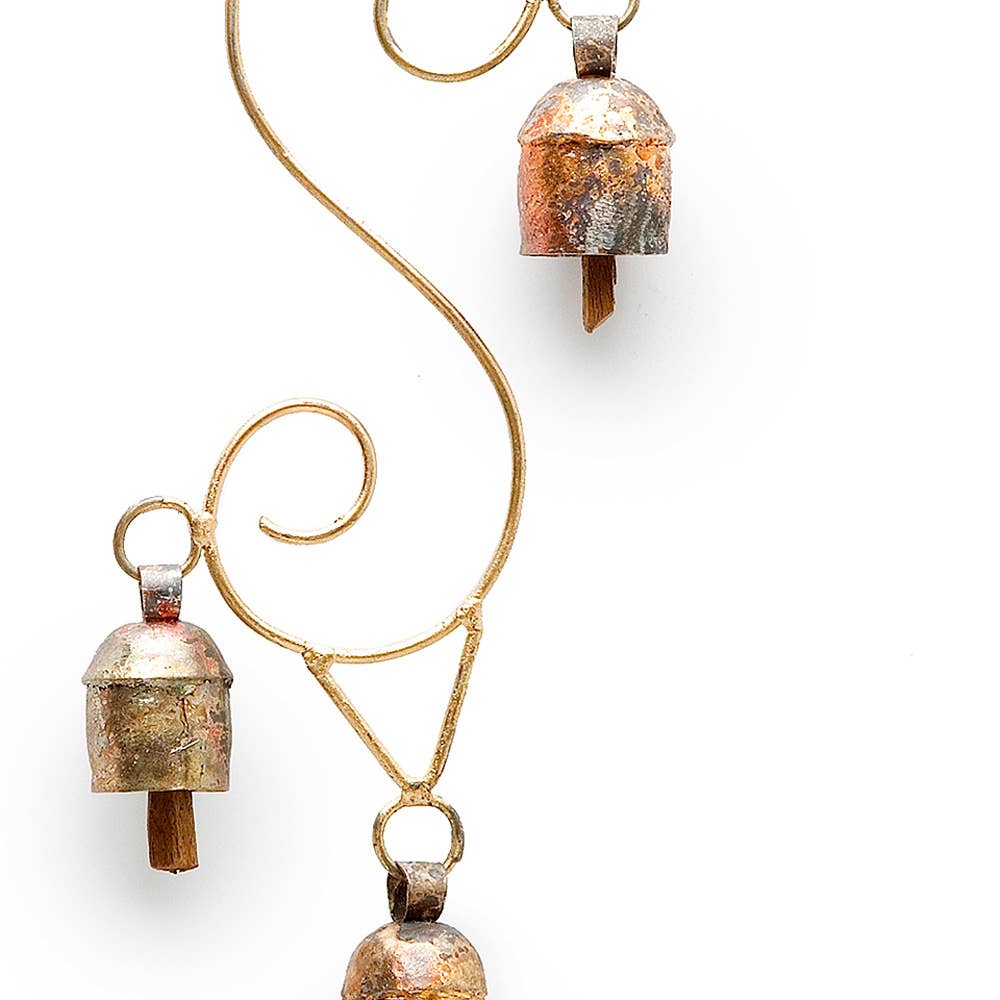 A pair of rustic copper and gold bell earrings on a clean white background.