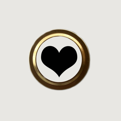 Black heart symbol on a white background with a gold border
