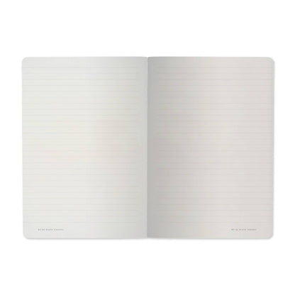 Open notebook with two blank pages on a white background