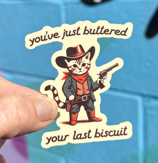 "Buttered Your Last Biscuit" Cowboy Cat Sticker