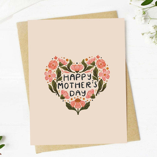 Greeting card with floral heart design and 'Happy Mother's Day' text on a beige background