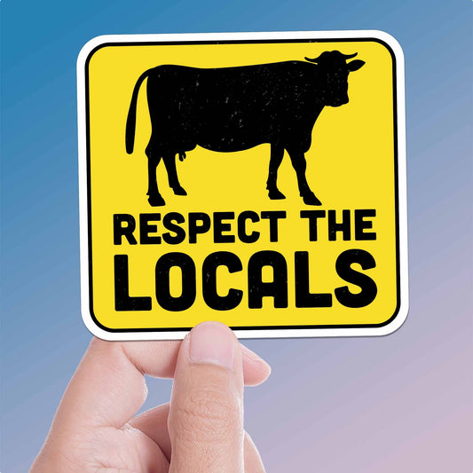 Hand holding a sign with a cow silhouette and 'Respect the Locals' text against a blue background