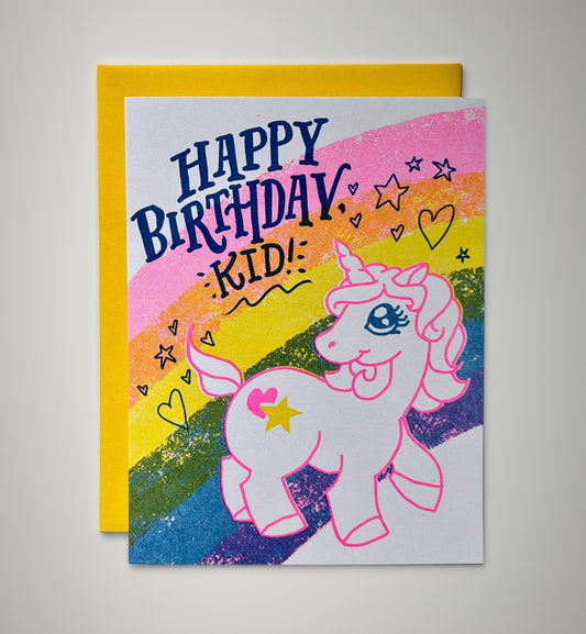 Birthday card with a unicorn illustration and colorful rainbow design.