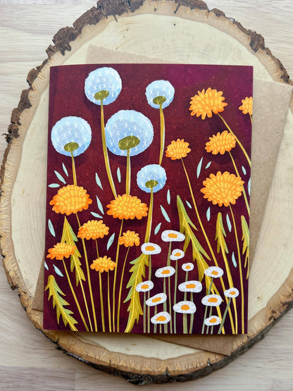 Card with floral design on a wooden surface