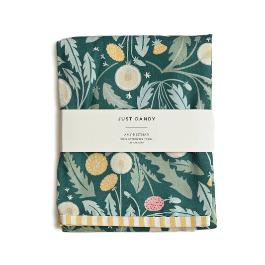 Folded fabric with floral pattern and 'Just Dandy' label on a white background