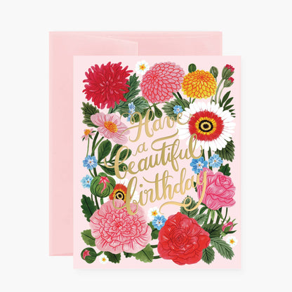 Greeting card with floral design and 'Have a beautiful birthday' text on a pink background