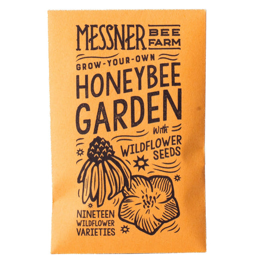 Seeds packet for a honeybee garden with wildflower seeds from Messner Bee Farm on an orange background.