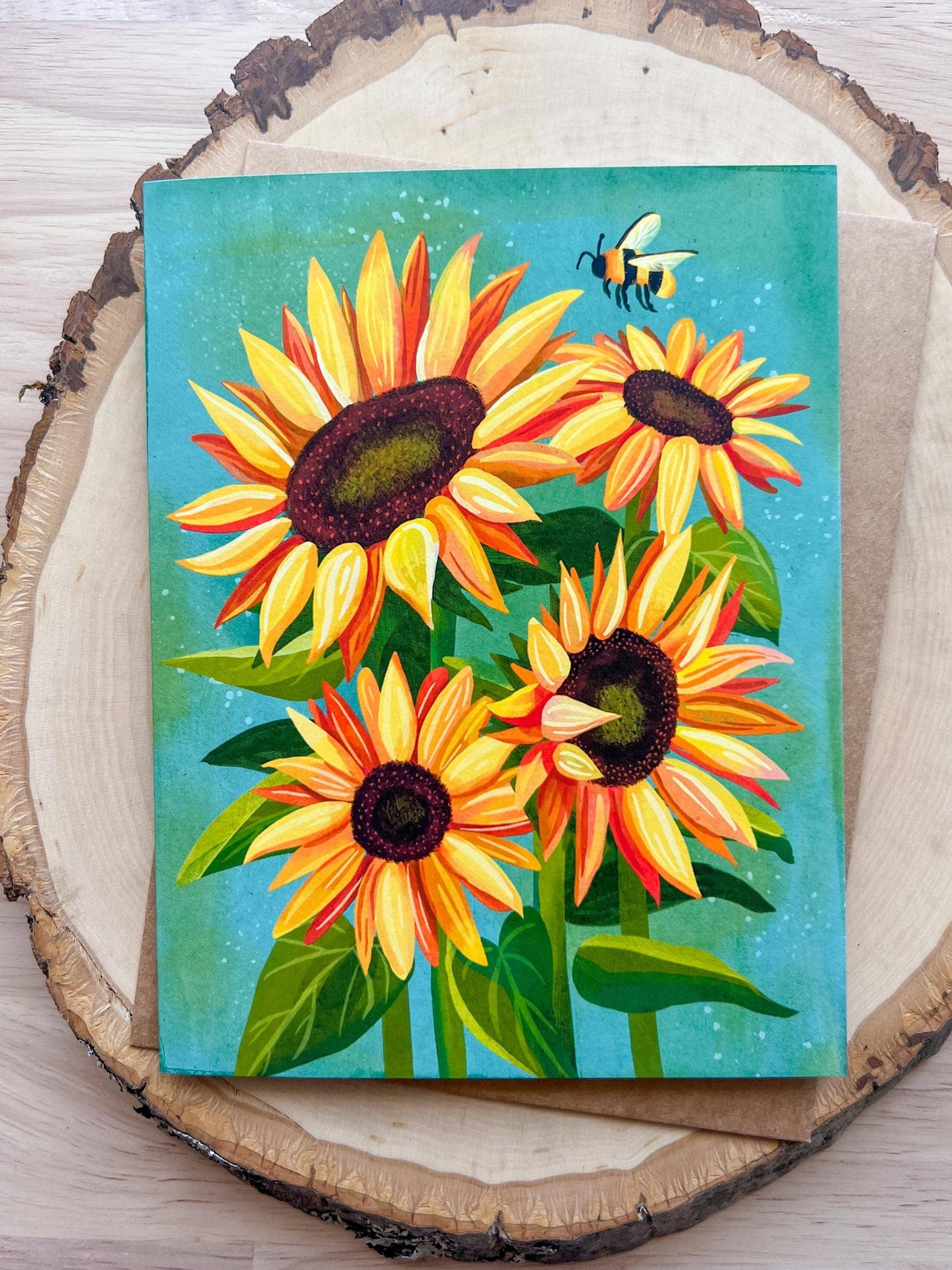 Painting of sunflowers and a bee on a wooden surface