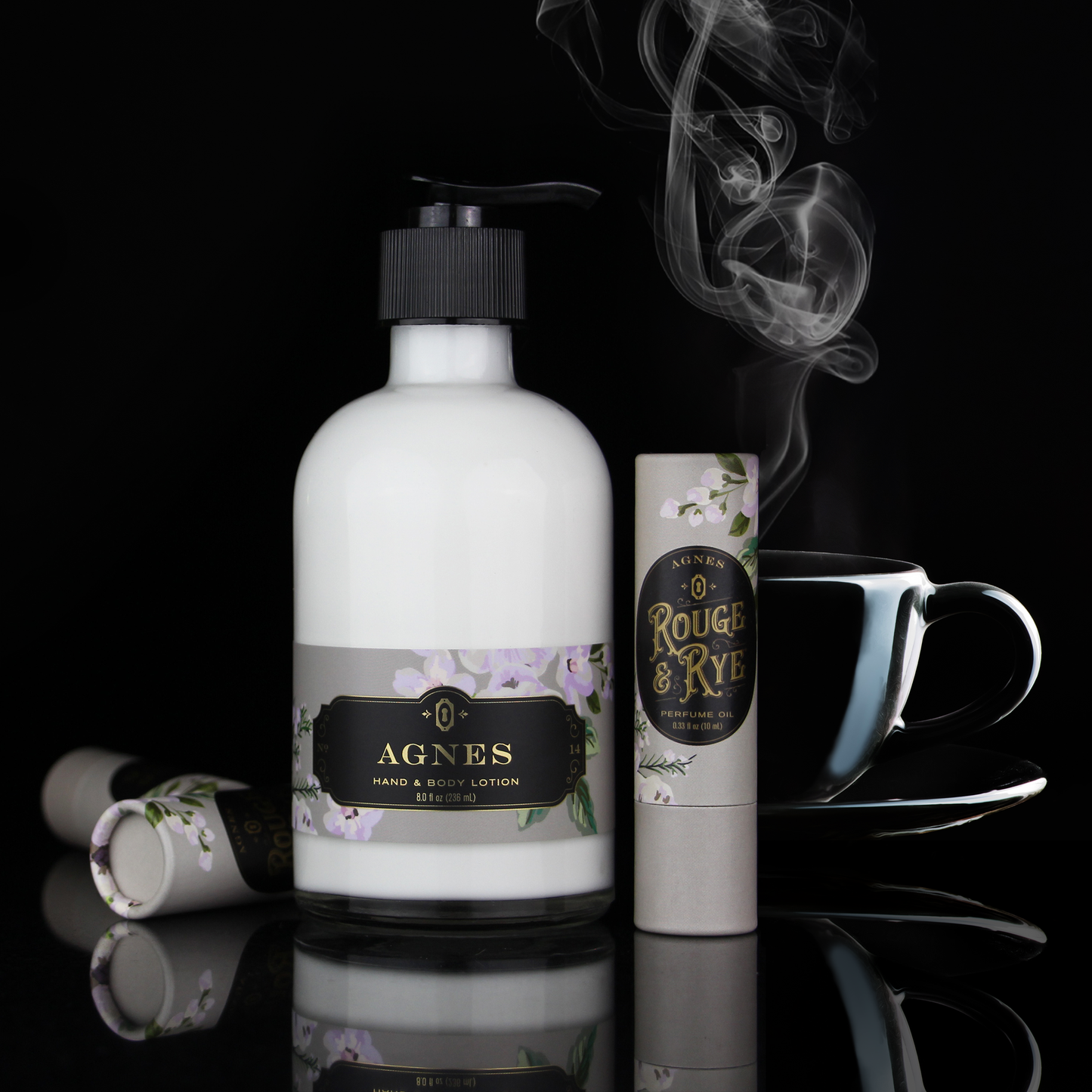 Bottle of Agnes hand and body lotion with a cup and other products on a reflective surface.