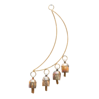 A gold-toned metal necklace featuring four small, dome-shaped bell charms with a distressed copper and silver patina, suspended from a thin curved gold chain on a white background.