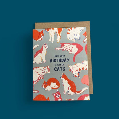 Greeting card with cat illustrations and text on a blue background