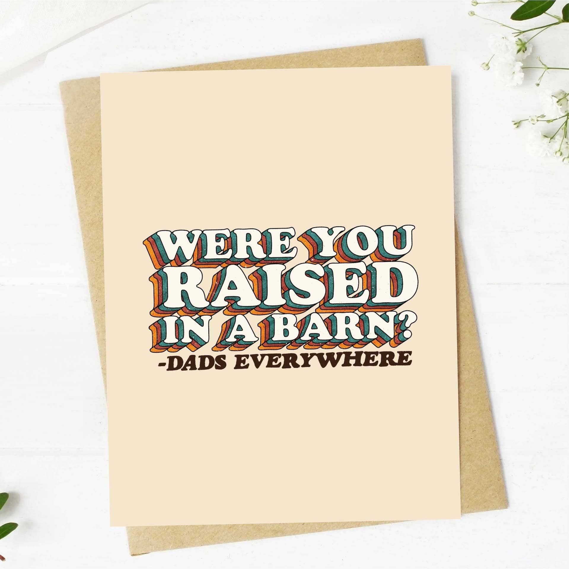 Card with text 'Were you raised in a barn? Dads everywhere' on a beige background