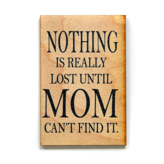Wooden sign with black text 'Nothing is really lost until Mom can't find it.' on a white background
