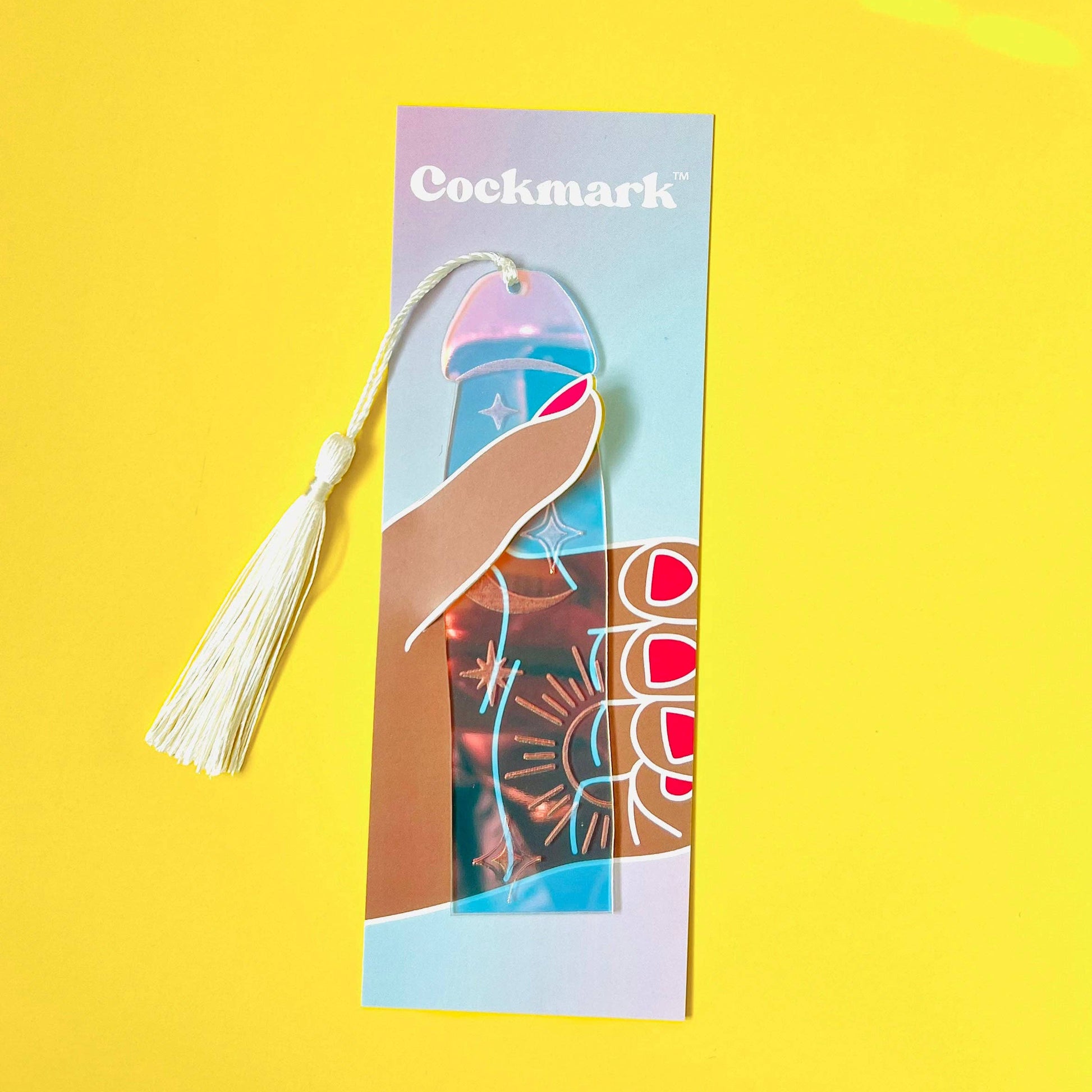 Cockmark product packaging with tassel on a yellow background