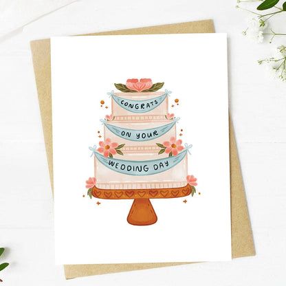 Card with a wedding cake illustration and 'Congrats on your wedding day' text, on a white background.