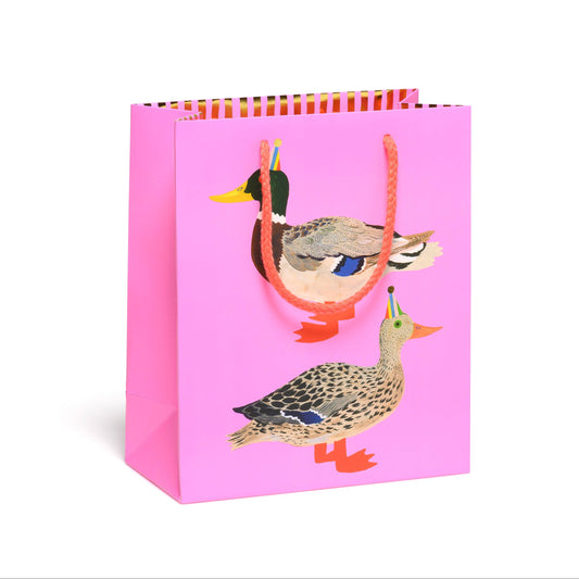 Pink gift bag with duck illustrations on a white background