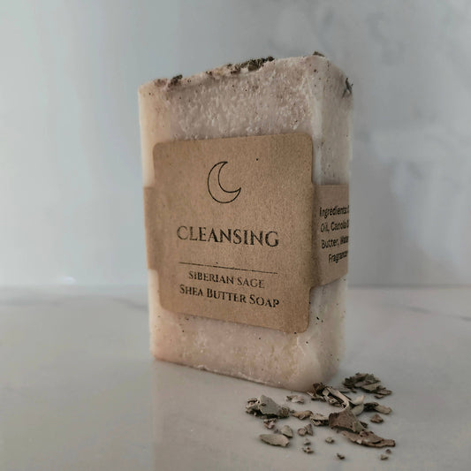 Bar of soap with a brown label on a light surface