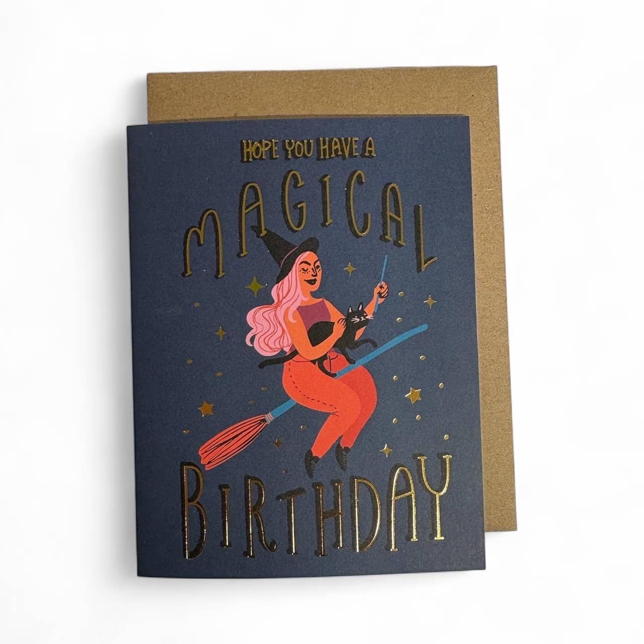 Greeting card with witch illustration and 'Magical Birthday' text on a blue background