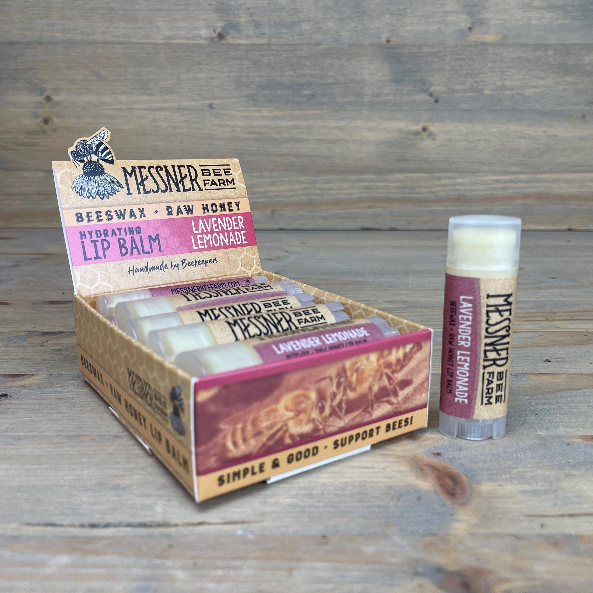 Messner Bee Farm lip balm packaging on a wooden surface