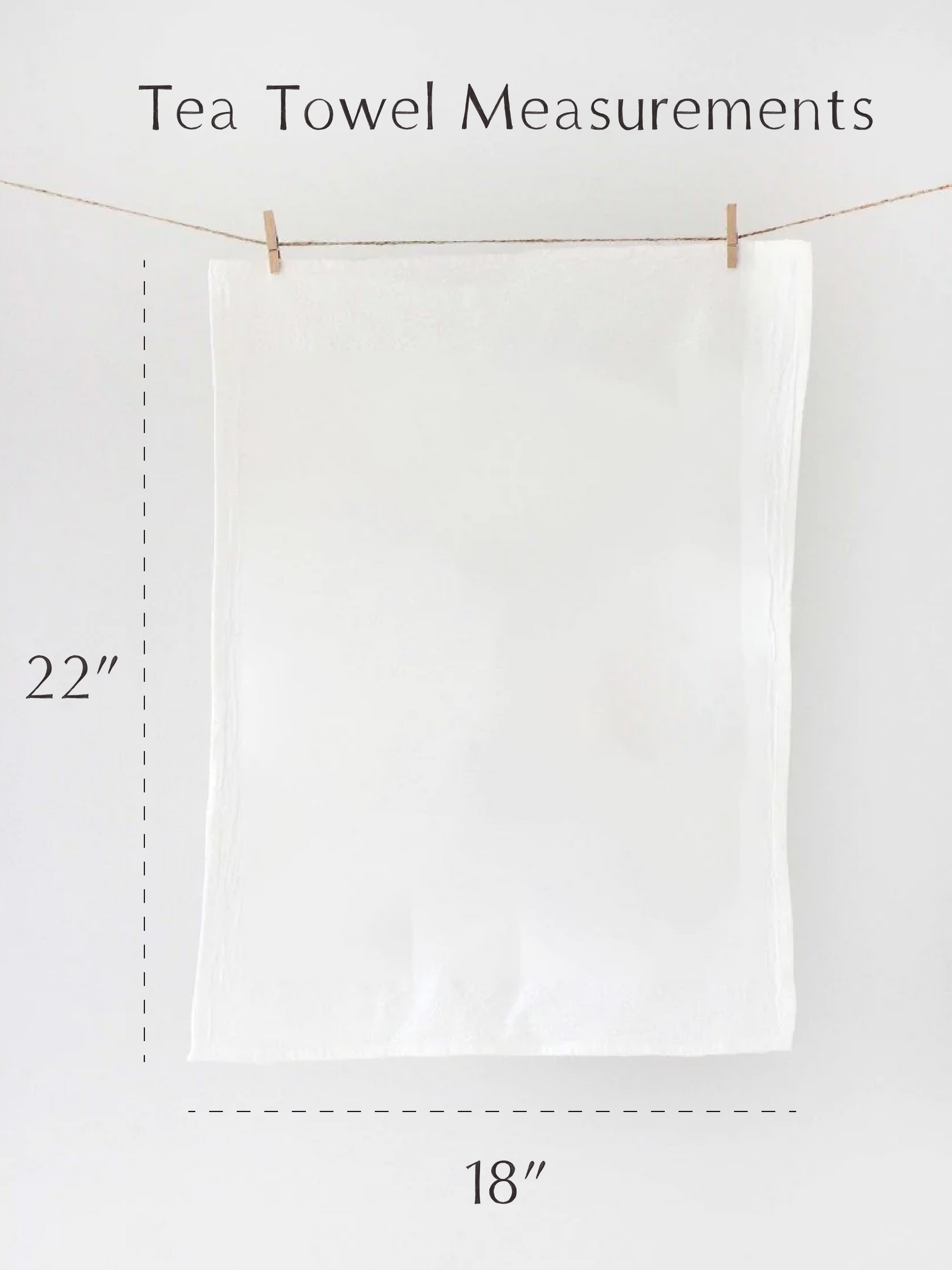 White tea towel hanging on a line with measurements indicated.