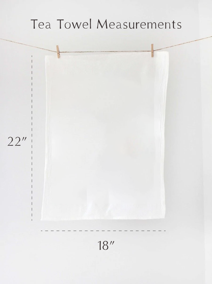 White tea towel hanging on a line with measurements indicated.