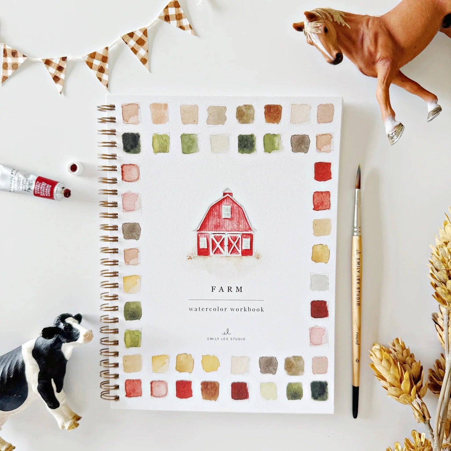 Color swatch workbook titled 'Farm' with a barn illustration, surrounded by model animals and a paintbrush on a white background.