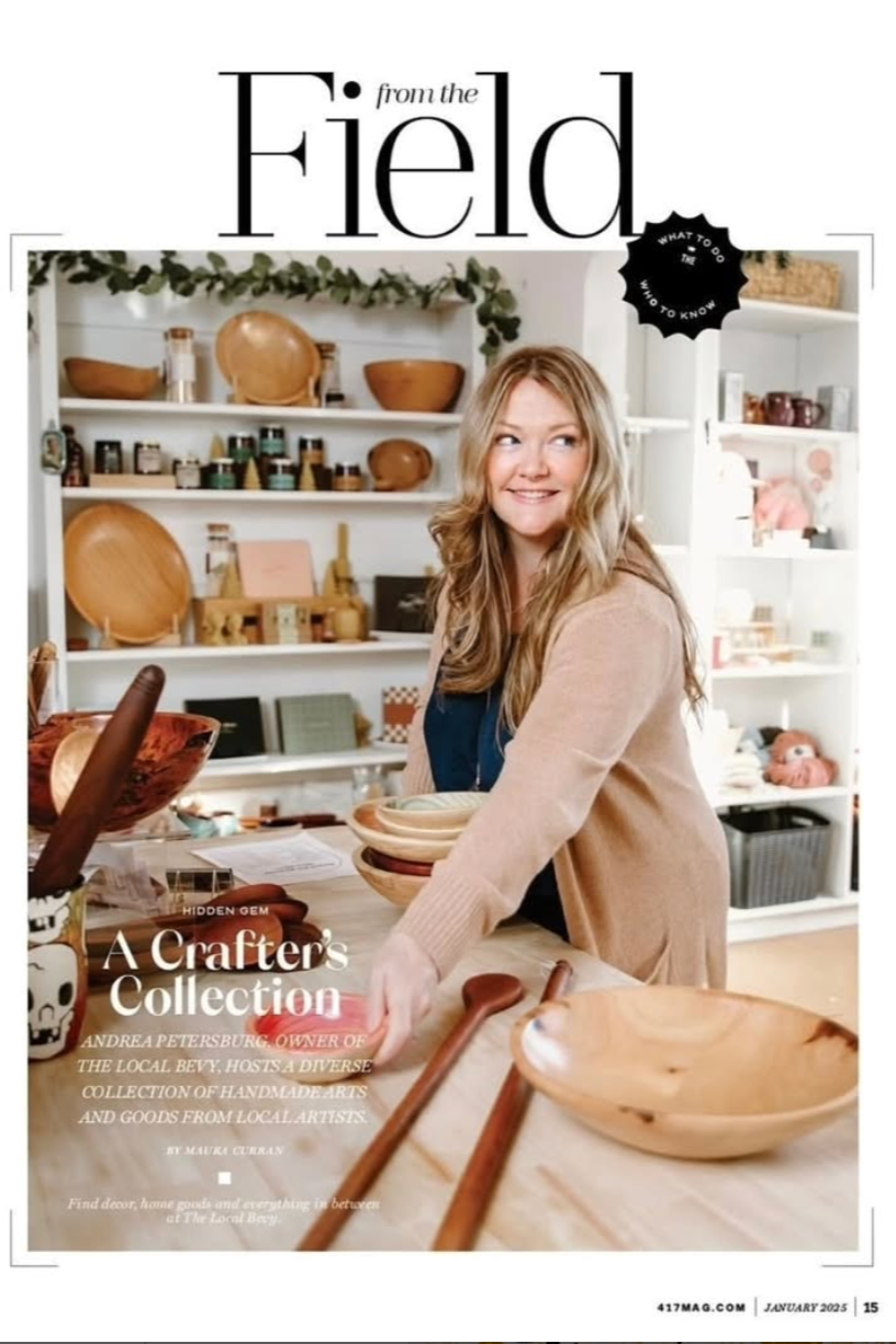 Magazine cover featuring the owner of the Local Bevy, Andrea Petersburg, n in a kitchen with wooden bowls and a red border.