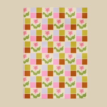 Colorful checkered pattern with floral designs on a beige background