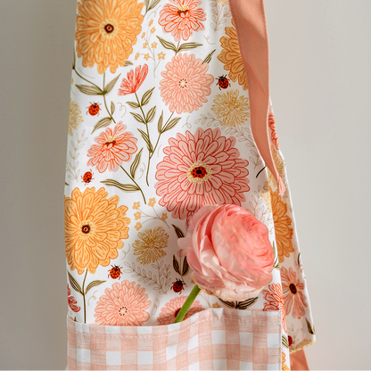 Floral-patterned tote bag held by a person against a neutral background