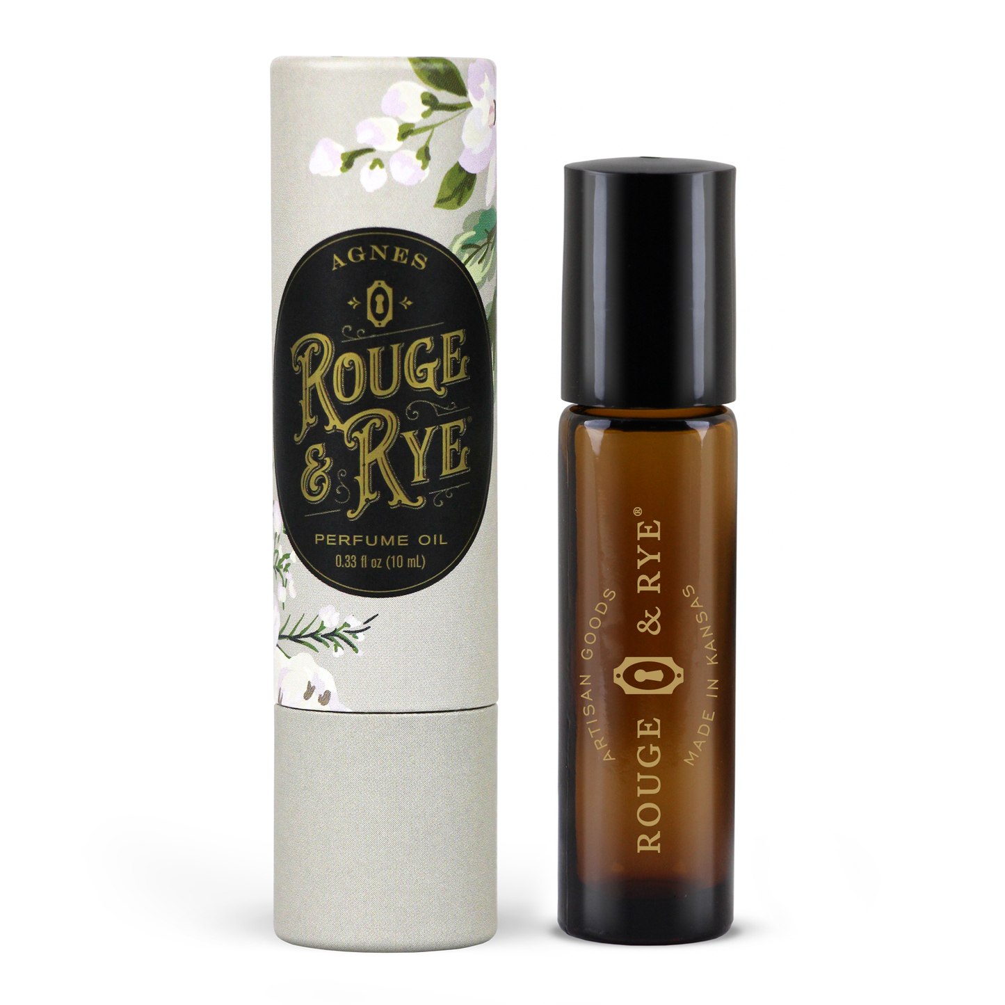 Rouge & Rye perfume oil by Agnes shown with its amber glass bottle and matching illustrated cardboard tube on a white background.