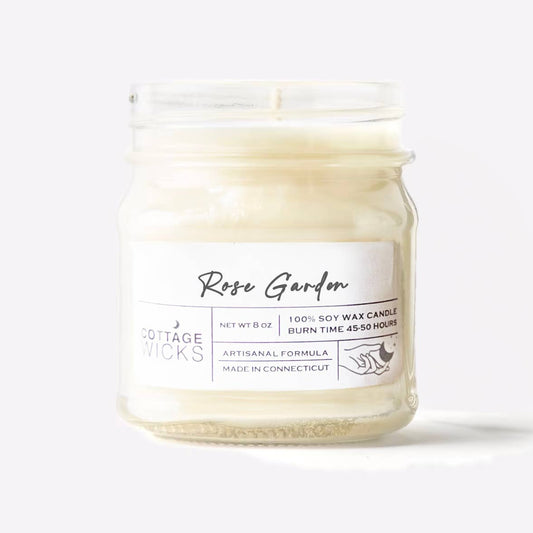 Candle jar labeled 'Rose Garden' by Cottage Wicks on a white background