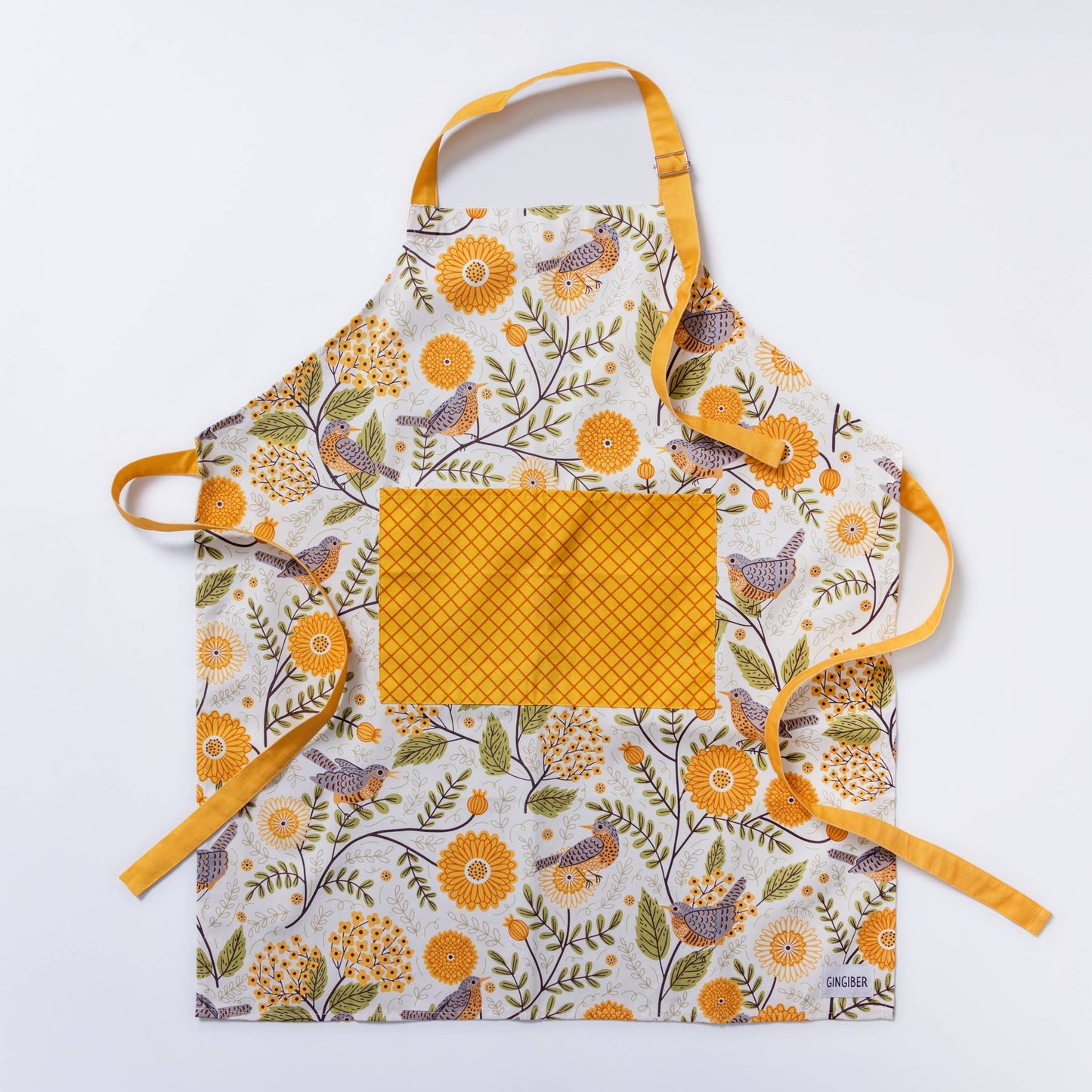 apron with floral and bird pattern on a white background