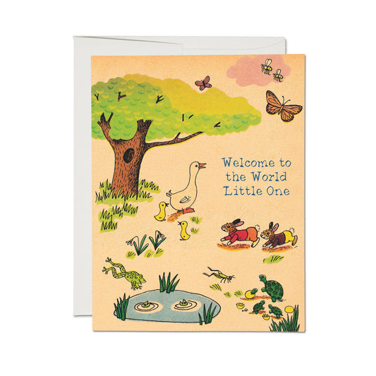 Greeting card with illustrations of animals and text 'Welcome to the World Little One' on a beige background.