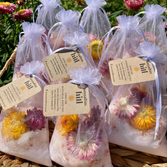 Clear bags with flowers and labels on a natural background|843