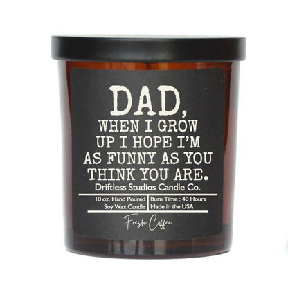 Candle with a humorous message on the label against a white background