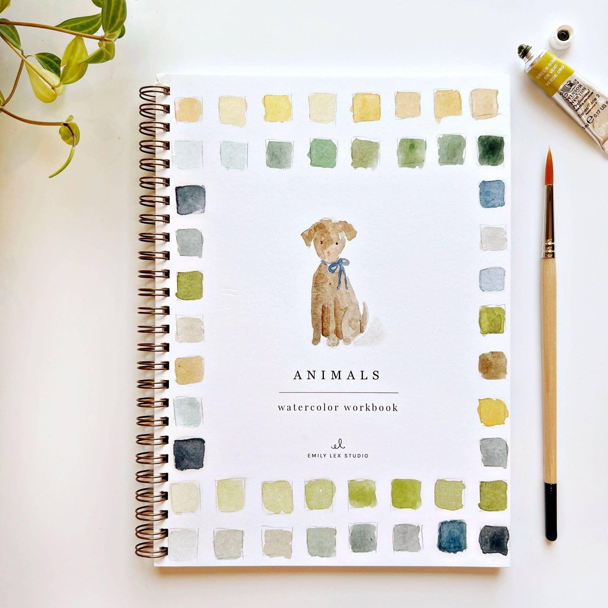 Watercolor workbook titled 'Animals' with a dog illustration on a white surface.