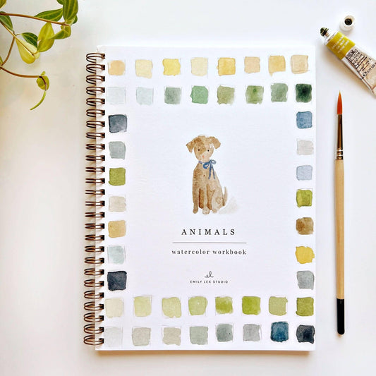 Watercolor workbook titled 'Animals' with a dog illustration on a white surface.