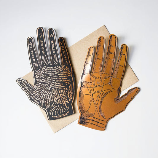 Two palmistry hands on a beige background