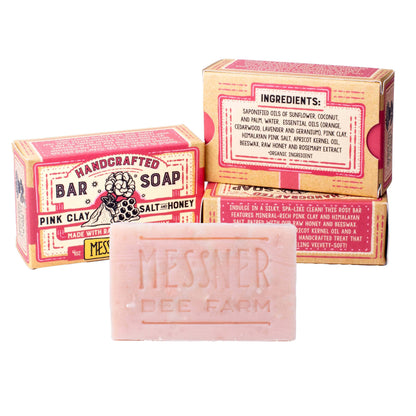 Messher Bee Farm Hardcrafted Bar Soap in Pink Clay scent, shown with its pink and tan cardboard packaging boxes on a white background.