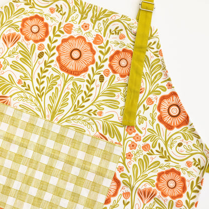 Floral and checkered fabric with a green strap on a white background